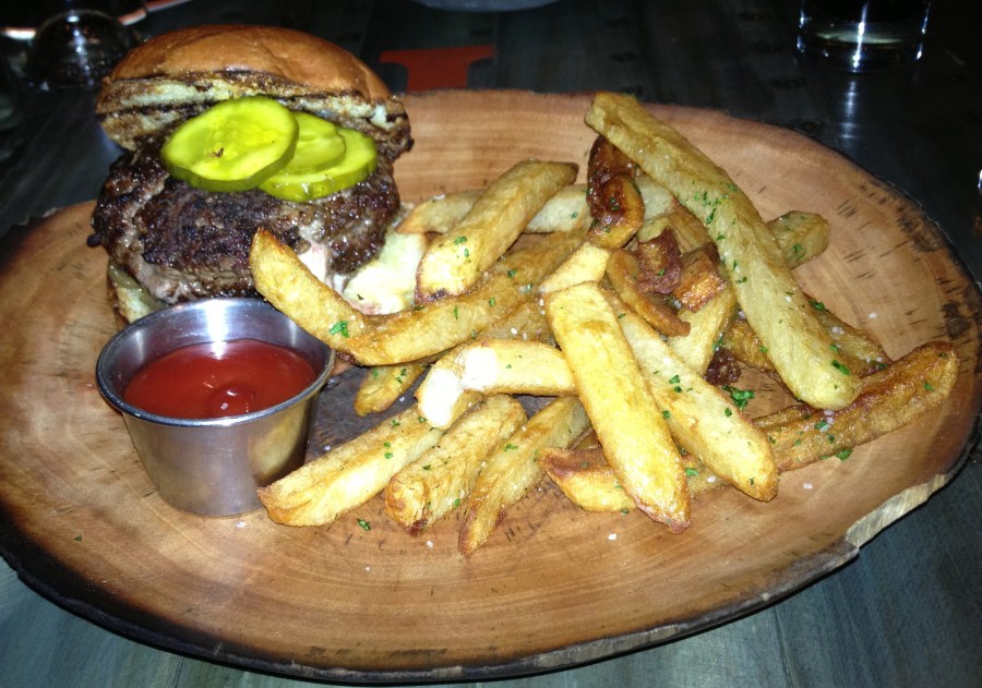 Juicy Lucy. Check out the wood plate and the thrice-cooked fries.