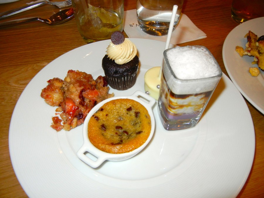 Dessert sampler: tiramisu, hot cookie, apple-cherry cobbler and a cheesecake lollipop.